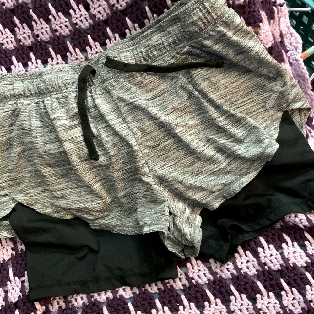 Grey REEBOK running athletic shorts size medium. Biker shorts attached